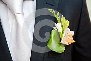 Boutonniere on the lapel of the groom