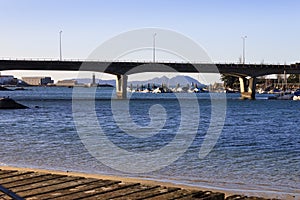 Bouzas bridge and marina with Cies island on background in Vigo photo