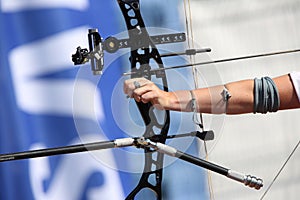 Bow and arrow in the hands of an archer