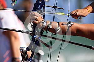 Bow and arrow in the hands of an archer