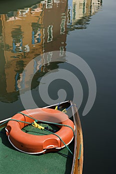 Bow of boat with life preserver.