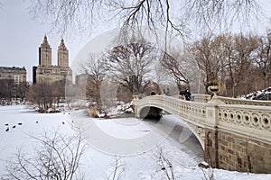 Central Park: February 14, 2021 Central Park in the winter with view of upper west side buildings and the bow bridge