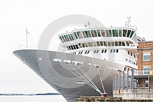 Bow and Bridge of White Luxury Cruise Ship at Pier