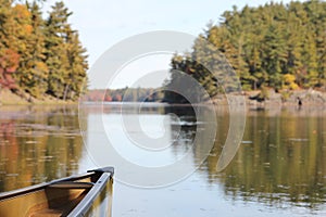Bow of canoe on calm lake