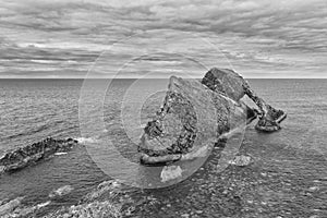 Bow-fidle Rock landscape on the coast of Scotland on cloudy afternoon artistic conversion