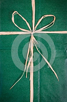 Bow on green paper package