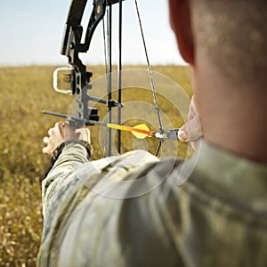 Bow hunter with compund bow. photo