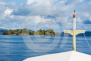 The bow of a liveaboard as it approaches a tropical island in Flores, Indonesia