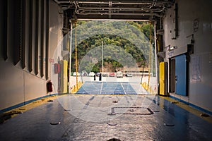 Bow ramp of ferry and cars inside of ferry. view from inside ferry