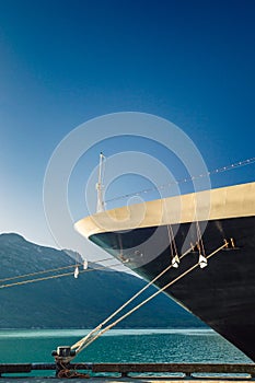 Bow, rat guards and mooring lines of berthed cruise ship,, Alaska, USA.