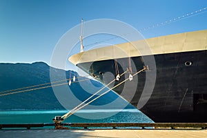 Bow, rat guards and mooring lines of berthed cruise ship,, Alaska, USA.