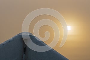 The bow of a rowing boat and the reflection of the Sun