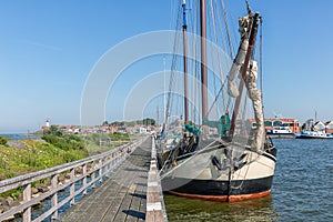 Bow sailing ship moored at pier of Dutch village Urk