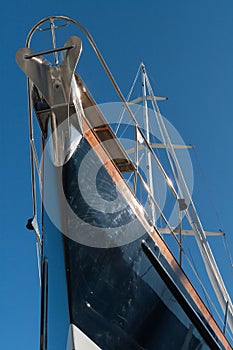 Bow of a sailing yacht on blue sky