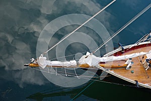 The bow of a schooner from above