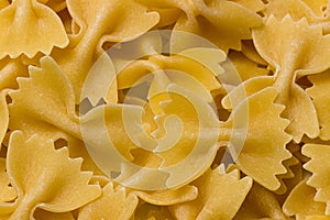 Bow tie pasta Close up. Farfalle pasta. Farfalle bows italian pasta. Farfalle - bow shaped pasta