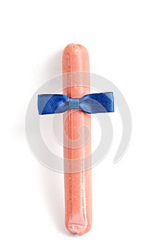 Bow-tie on a sausage on white background