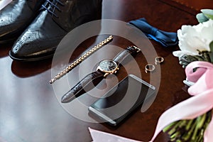 Bow tie,shoes,wedding rings ,telephone,clock,bride`s bouquet,the