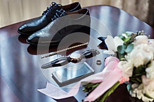 Bow tie,shoes,wedding rings ,telephone,clock,bride`s bouquet,the