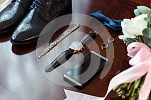Bow tie,shoes,wedding rings ,telephone,clock,bride`s bouquet,the