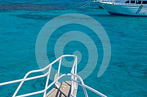 Bow of a white yacht on background of sea water