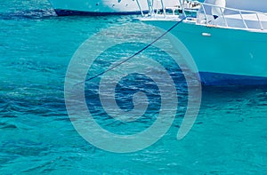 Bow of a white yacht on background of sea water