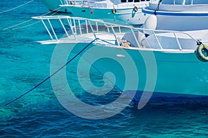 Bow of a white yacht on background of sea water