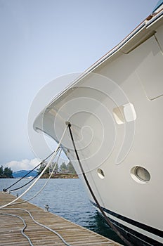 Bow of yacht moored at a dock in a harbor