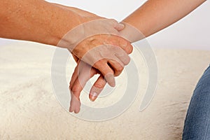 Bowen therapy of a woman`s hand