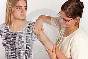 Bowen therapy of a young woman. The therapist giving bowen treat