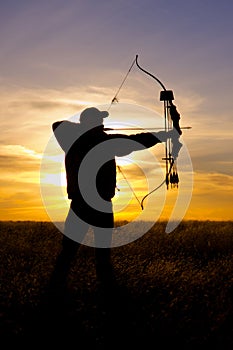 Bowhunter at Sunset