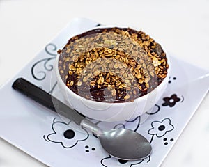Bowl of acai berry with granola