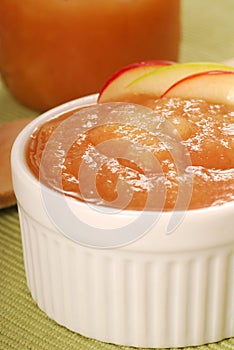 Bowl of applesauce with apple garnish