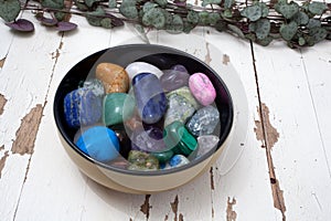 A bowl of assorted gemstones