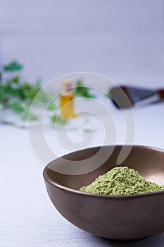 A bowl of the ayurvedic powder Sidr Zizyphus jujuba on a light background