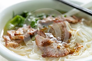 Bowl of bbq prok with rice noodles