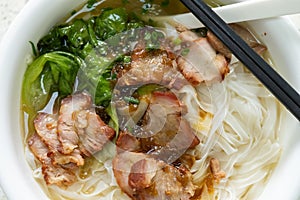 Bowl of bbq prok with rice noodles