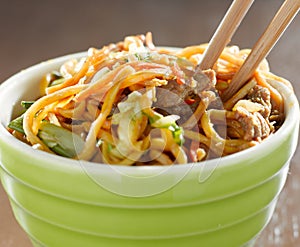 bowl of beef lo mien in a bowl with chopsticks