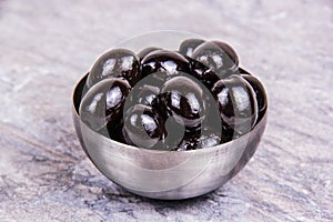 Bowl of black olives. Olives close up
