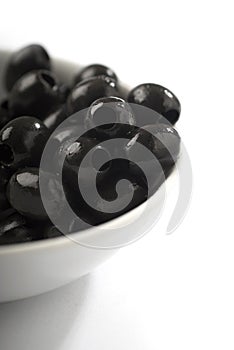Bowl of black pitted olives photo