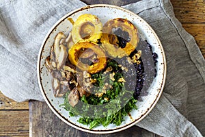 Black rice with roasted delicata squash, massaged kale and shiitake mushrooms