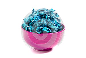 A Bowl of Blue Wrapped Candy on a White Background