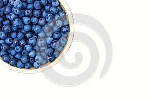 Bowl of blueberries isolated on white