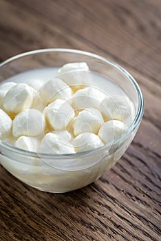 Bowl of Bocconcini mozzarella on the wooden table