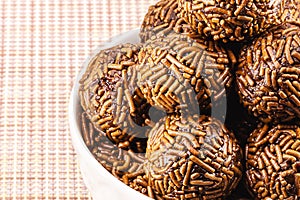 bowl with brigadeiros, typical Brazilian chocolate bonbon, copyspace, Brazil\'s favorite candy at parties, macro photography