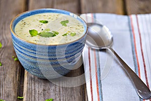 Bowl of broccoli and cheddar cheese soup