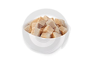 Bowl of brown sugar cubes isolated on white