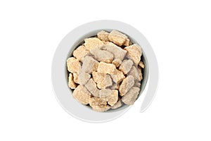 Bowl with brown sugar slices isolated