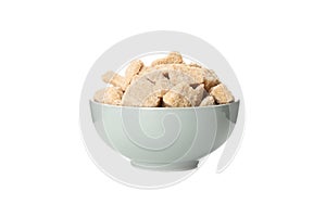 Bowl with brown sugar slices isolated on background