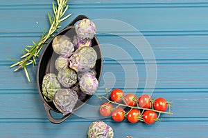 A Bowl of Brussels Sprouts on blue background